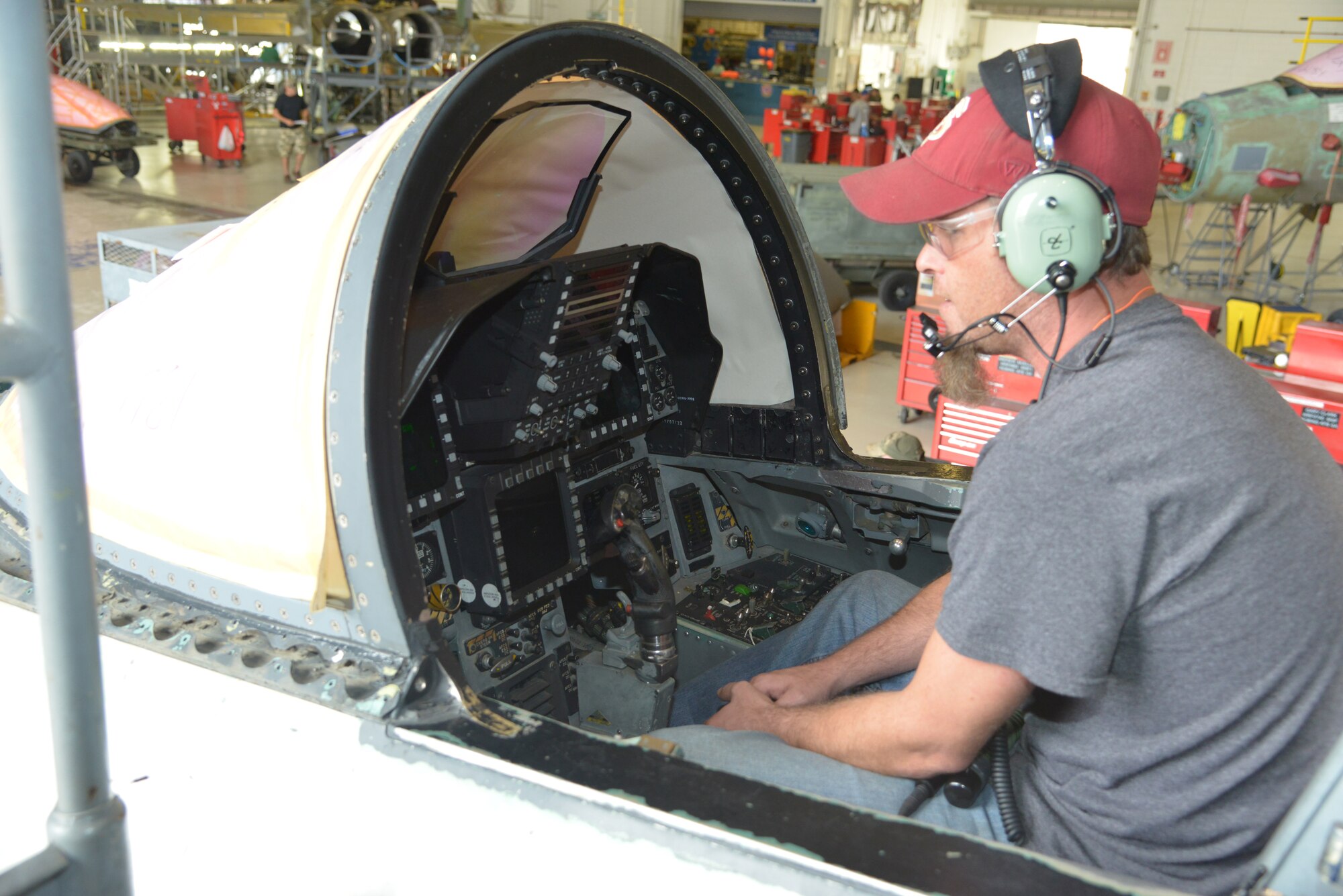 Phillip Gates, 560th Aircraft Maintenance Squadron electronics worker, performs an operations check from inside the cockpit of an F-15. The Warner Robins Air Logistics Complex is responsible for performing programmed depot maintenance on F-15s. (U.S. Air Force photo by Ray Crayton)