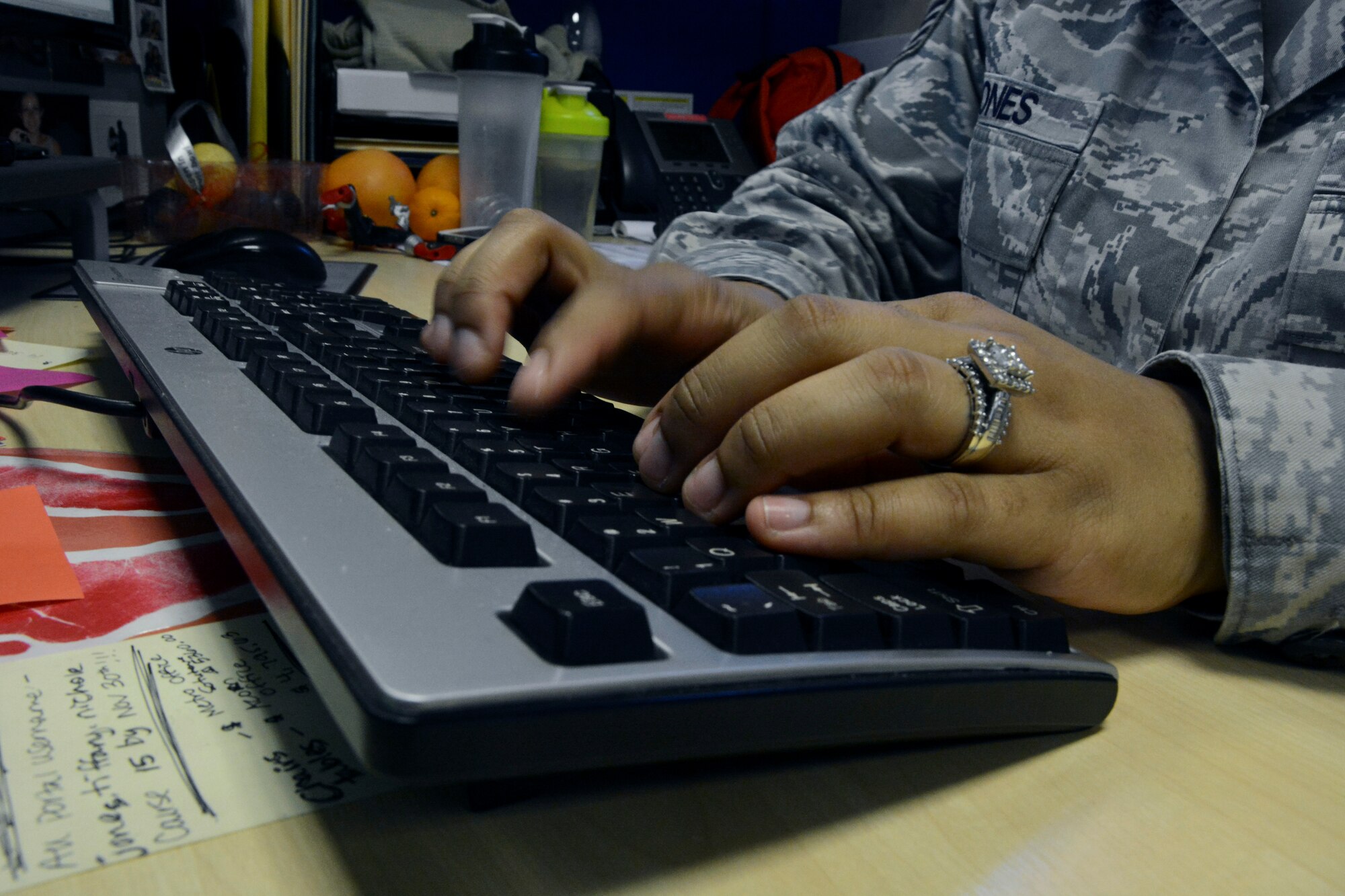 U.S. Air Force Staff Sgt. Tiffany Jones, 100th Comptroller Squadron Wing Staff Agency resource advisor from Hampton, Va., works on a computer Sept. 30, 2014, on RAF Mildenhall, England.  Jones, along with other Airmen from the 100th CPTS, stayed after normal duty hours to allocate funding for the end of fiscal year close out. Each year the Air Force receives funding for defense related expenditures that must be allocated by Sept. 30. (U.S. Air Force photo/Staff Sgt. Micaiah Anthony/Released)