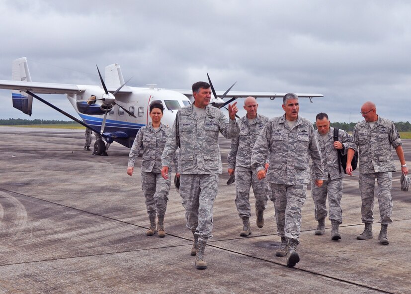 Col. James Phillips, 919th Special Operations Wing commander (foreground
right) leads a tour of Duke Field, Fla., for Lt. Gen. Brad Heithold,
commander of Air Force Special Operations Command, Sept. 29, 2014.  Behind
them are (from left):  Lt. Col. Kelly Gwin, 919th Special Operations Mission
Support Group deputy commander; Col. David Tabor, Air Force Special
Operations Air Warfare Center commander; and Chief Master Sgts. Matthew
Caruso, AFSOC command chief; and Tom Mason, 919th SOW command chief. During
Heithold's first tour of Duke as AFSOC's new top officer, he and his fellow
command leaders received an overview of ongoing and future 919th SOW
missions.  (U.S. Air Force photo/Dan Neely)
