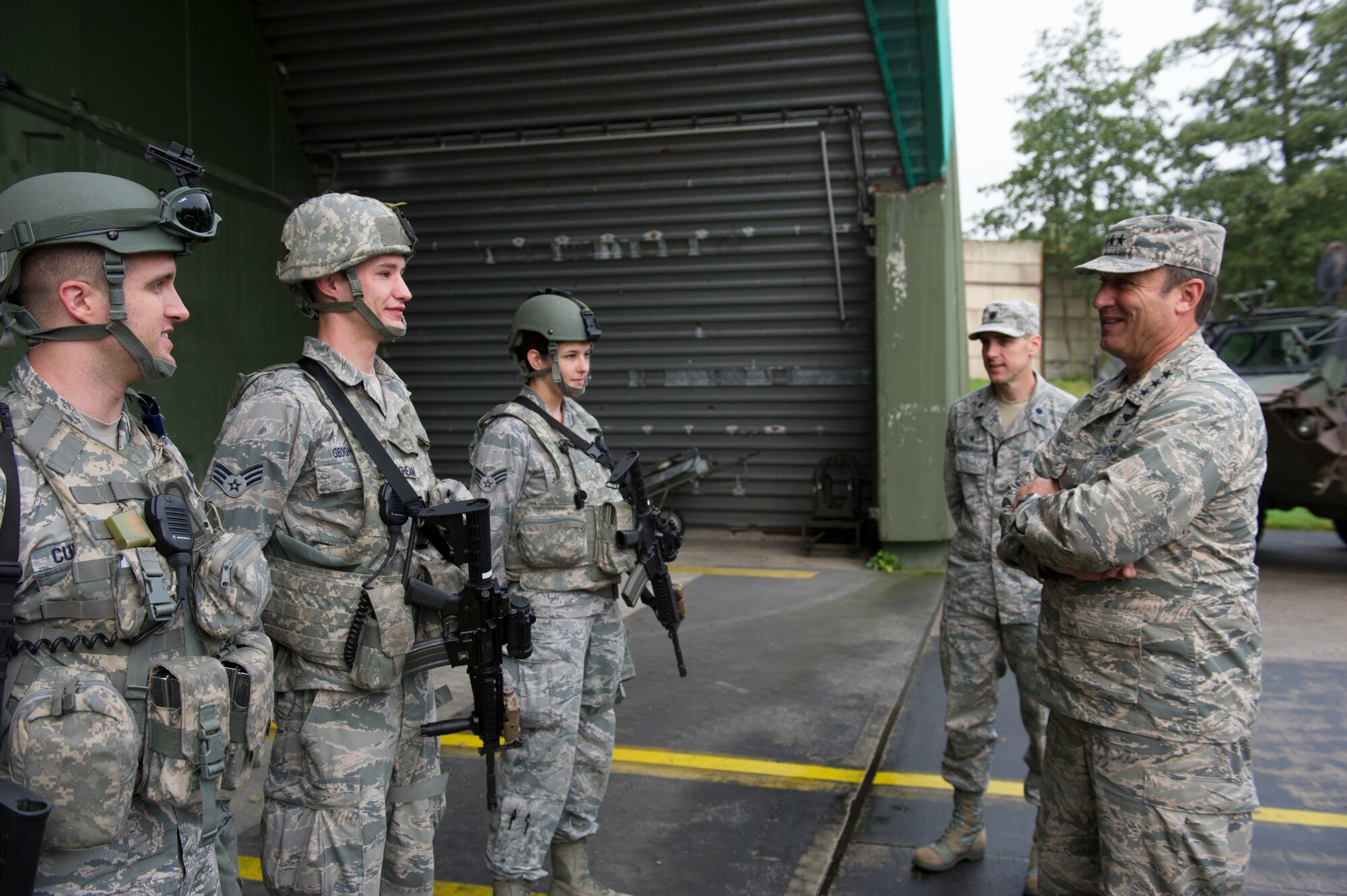 BEUCHEL AIR BASE, Germany -- Lt. Gen. Tom Jones, U.S. Air Forces in Europe and Air Forces Africa vice commander, speaks with security forces Airmen during his visit to the 702nd Munitions Support Squadron at Buechel Air Base, Germany, Sept. 30, 2014. The vice commander and other senior members of the USAFE-AFAFRICA staff visited munitions support squadrons at three locations to receive mission briefs and updates on current challenges at the locations. (U.S. Air Force photo by/Tech. Sgt. Benjamin Wilson)