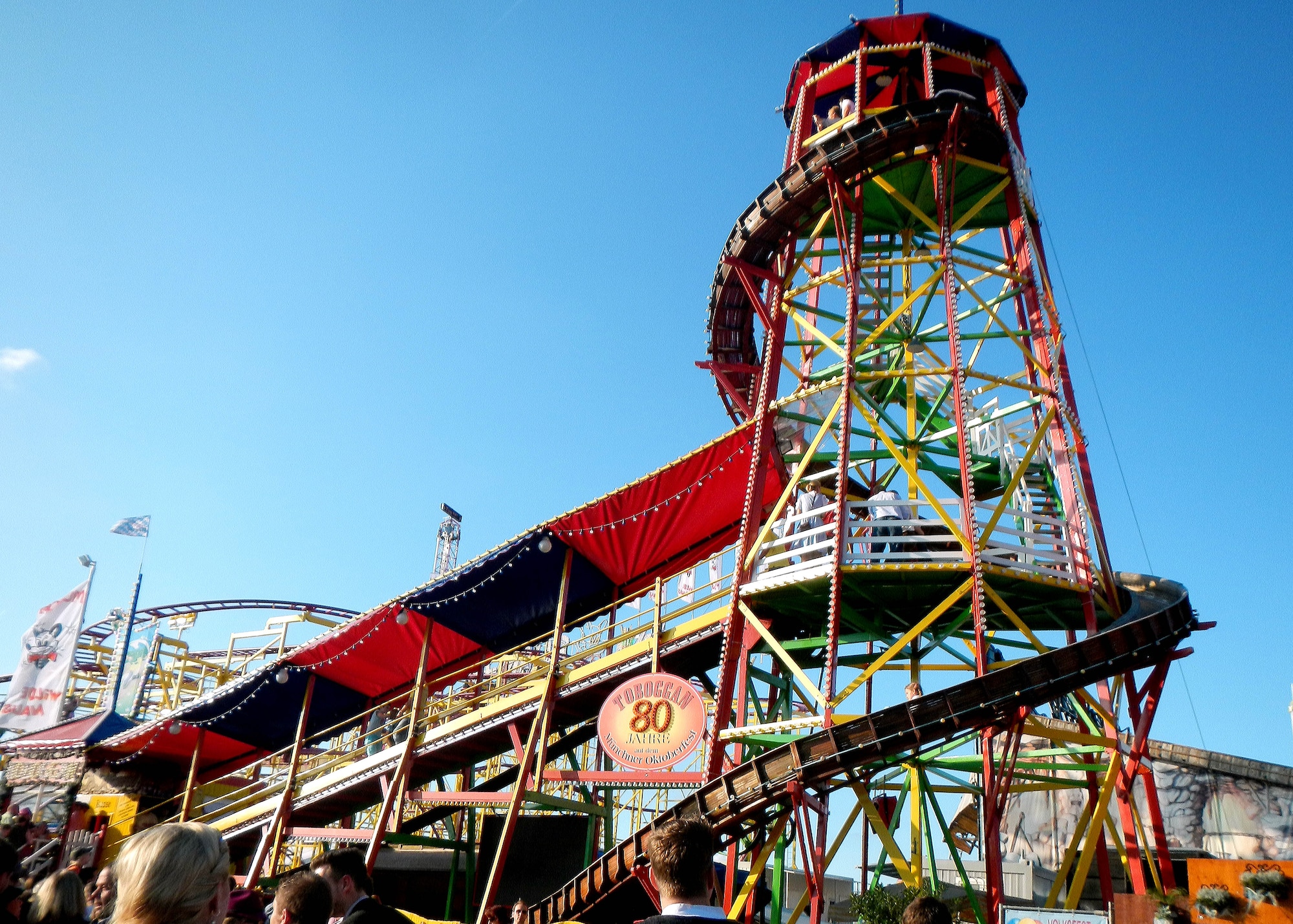 “The Toboggan” is a traditional Oktoberfest carnival ride that entertains both riders and spectators. Riders are bolted midway by a conveyer belt and then proceed to climb more than 70 stairs to slide down a wooden slide. This model has been shown at Oktoberfest for 80 years. (U.S. Air Force photo/Airman 1st Class Deana Heitzman)
