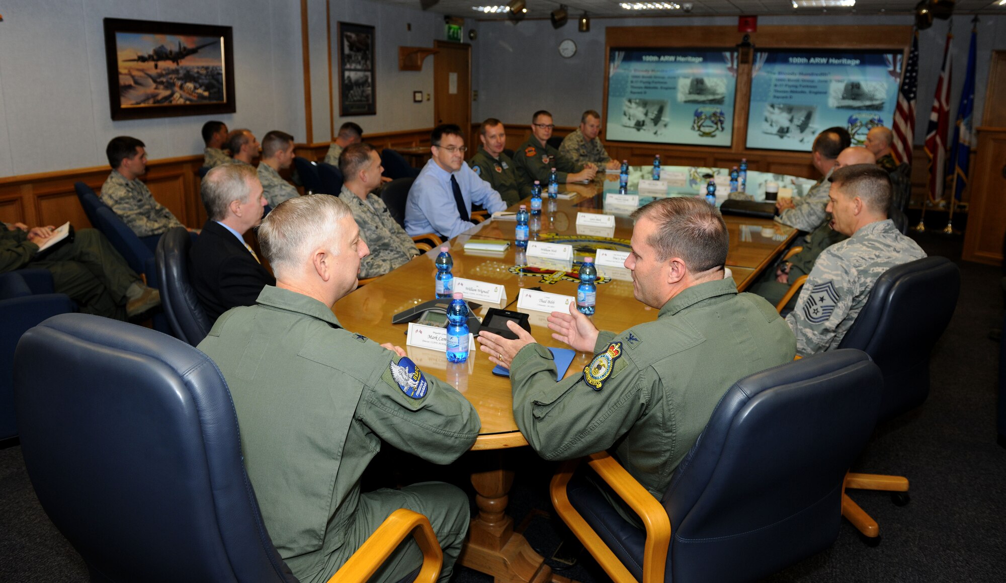 U.S. Air Force Col. Kenneth T. Bibb Jr., right, 100th Air Refueling Wing commander, gives a mission brief to U.S. Air Force Brig. Gen. Mark Camerer, left, U.S. Air Forces in Europe and U.S. Air Forces Africa director of plans, programs and analyses, Sept. 30, 2014, on RAF Mildenhall, England. During Camerer’s first visit to RAF Mildenhall since assuming his current position, he toured several facilities and met a multitude of Airmen to better understand the base’s requirements and mission capabilities. (U.S. Air Force photo/Senior Airman Kate Maurer/Released) 