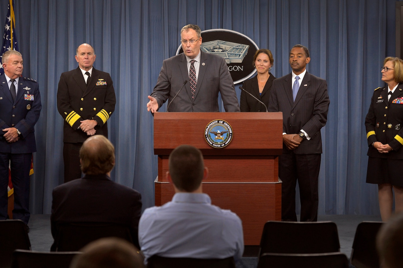 Deputy Defense Secretary Bob Work, flanked by service surgeon generals and other Defense Department health officials, briefs reporters on the Military Health System at the Pentagon, Oct. 1, 2014. DoD photo by Glenn Fawcett