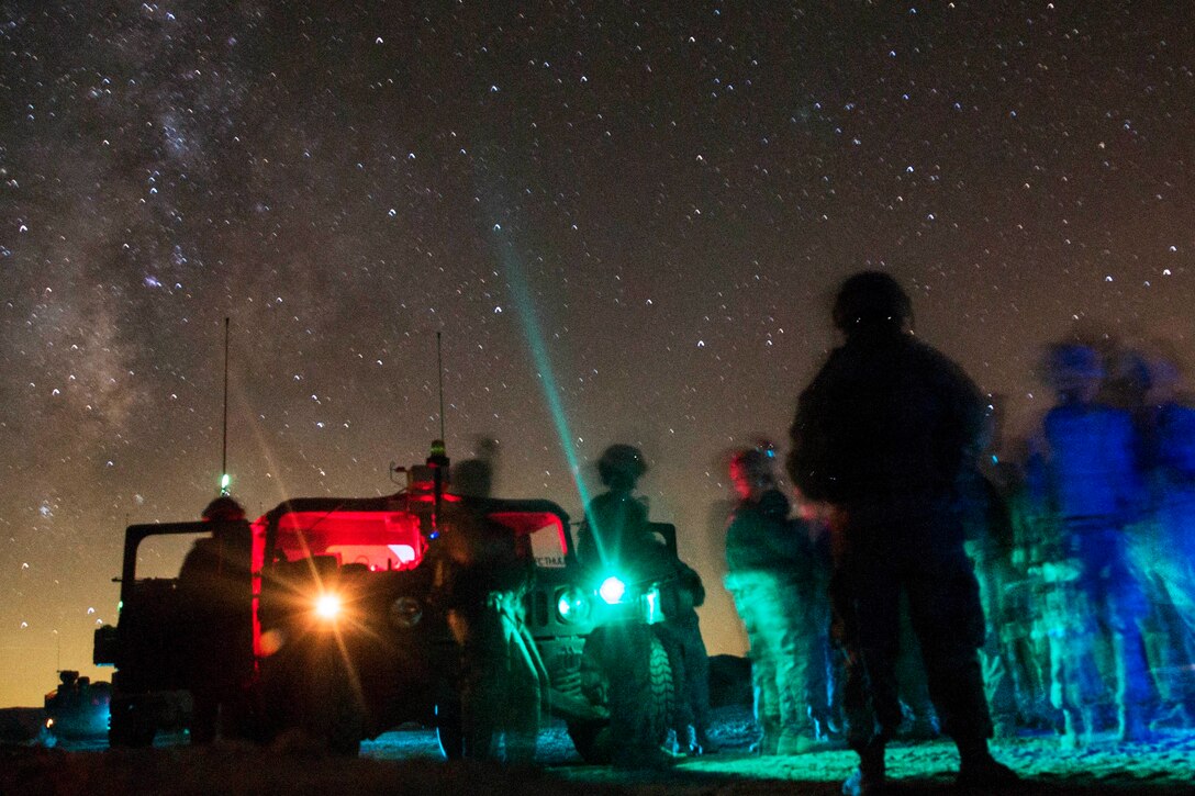 Soldiers conduct a mission brief before a reconnaissance patrol during rotation 14-10 at the National Training Center on Fort Irwin, Calif., Sept. 24, 2014.