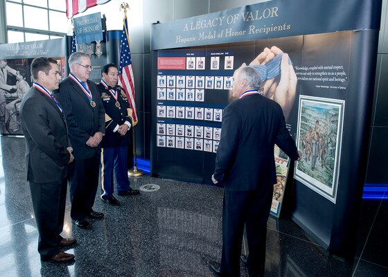 Hispanic Medal of Honor Society President Rick Leal, right, discusses the society’s Legacy of Valor exhibit with DIA leadership Sept. 29.