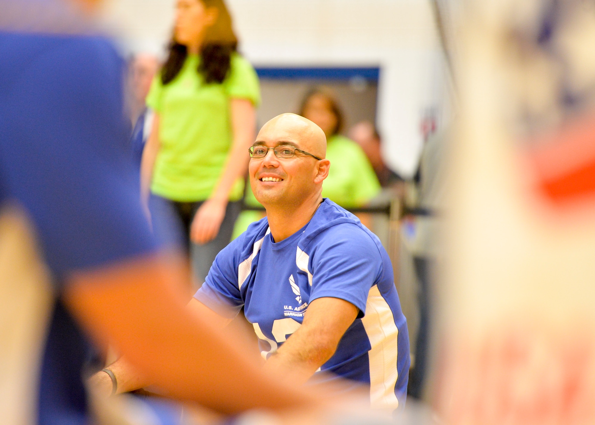 Air Force Master Sgt. Christopher Aguilera warms up prior to the start of the 2014 Warrior Games sitting volleyball bronze medal match between the Air Force and the Army Oct. 1, 2014, at the U.S. Olympic Training Center in Colorado Springs, Colo. The Army beat the Air Force in two sets, 25-20, 25-19. (U.S. Air Force photo/Staff Sgt. Devon Suits) 