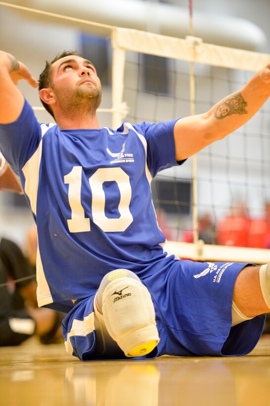 Retired Air Force Staff Sgt. Nicholas Dadgostar warms up prior to the start of the 2014 Warrior Games sitting volleyball bronze medal match between the Air Force and the Army Oct. 1, 2014, at the U.S. Olympic Training Center in Colorado Springs, Colo. The Army beat the Air Force in two sets, 25-20, 25-19. (U.S. Air Force photo/Staff Sgt. Devon Suits)