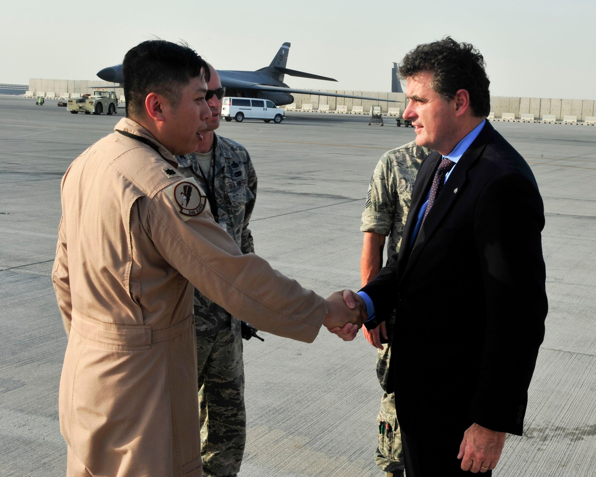 Congressman Michael Fitzpatrick, from Pennsylvania’s 8th District greets Lt. Col. Van Thai, 340th Expeditionary Air Refueling Squadron commander at Al Udeid Air Base, Qatar, Oct. 3, 2014. Fitzpatrick received a tour of the base and spoke with Airmen from his home state of Pennsylvania. (U.S. Air Force photo by Senior Airman Colin Cates)  