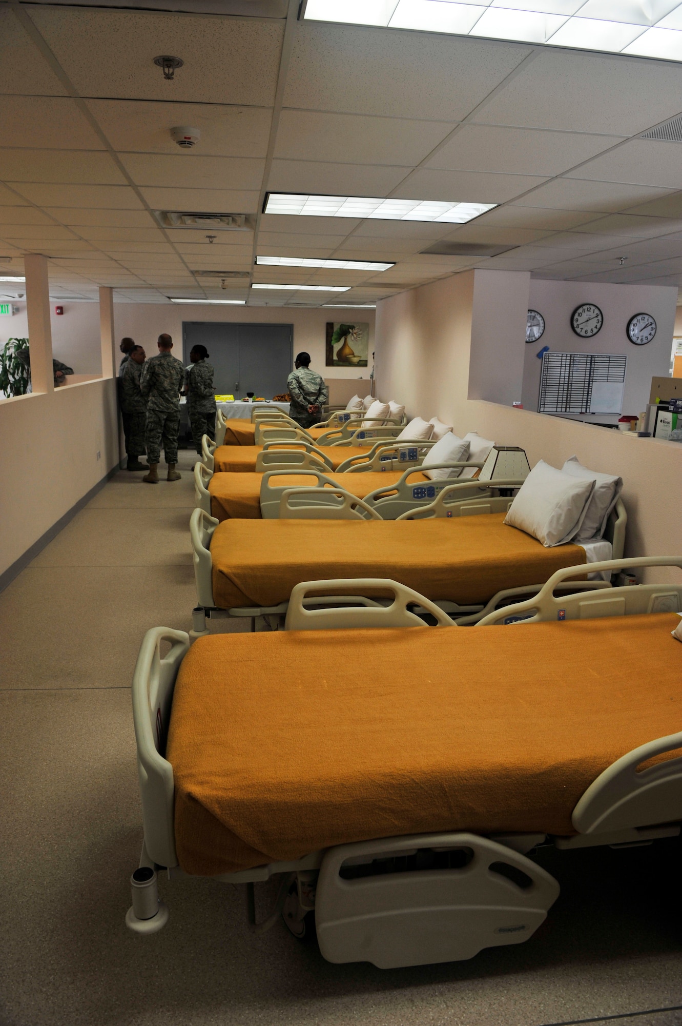 The 379th Medical Group opened a new En-route Patient Staging Facility at Al Udeid Air Base, Qatar, Sept. 30, 2014. The new facility will increase capabilities by more than 160 percent, by expanding capacity from 13 beds to 21. The facility will help return Service members to the fight sooner, while providing that service in a state of the art facility. (U.S. Air Force photo by Senior Airman Colin Cates) 