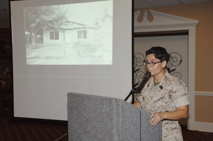 Hispanic Heritage Month guest speaker Master Sgt. Alejandra Medina shares portions of her life through a slide presentation and country music song, “The House that Built Me,” by Miranda Lambert, during a luncheon, Sept. 25.