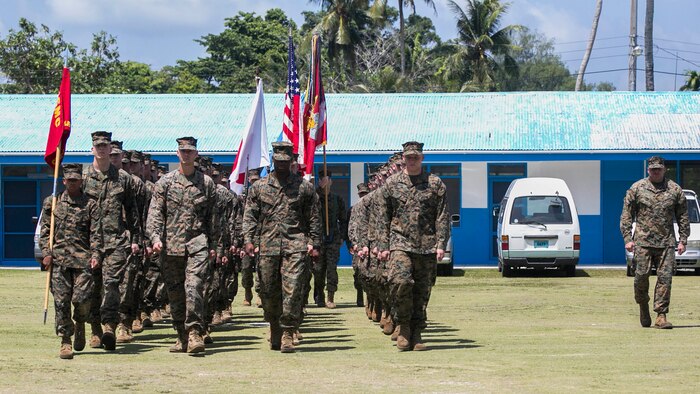 Marines with Combat Logistics Detachment 379 march in the 70th anniversary of the Battle of Peleliu ceremony Sept. 15 at Peleliu Elementary School in the Republic of Palau. The event brought together members of the Palau community, World War II veterans who served in the Battle of Peleliu, elected officials of Palau and representatives the U.S. military to remember the landing that took place 70 years earlier. The Marines with CLD-379 came to the Republic of Palau aboard the USNS Sacagawea as part of T-AKE 14-2, a maritime pre-positioned force, multi-country theater security cooperation event that deploys from Okinawa to conduct training exercises and TSC events. The Marines are from CLD-379, Combat Logistics Regiment 37, 3rd Marine Logistics Group, III Marine Expeditionary Force.