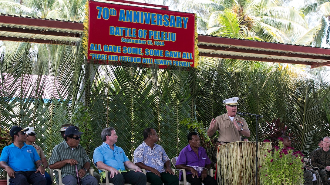 Maj. Gen. Charles L. Hudson, right, addresses a crowd during the 70th anniversary of the Battle of Peleliu ceremony Sept. 15 at Peleliu Elementary School in the Republic of Palau. Hudson was the key note speaker for the event, which brought together members of the Palau community, World War II veterans who served in the Battle of Peleliu, elected officials of Palau and representatives the U.S. military to honor the men who fought bravely on both sides. Hudson is the commanding general of Marine Corps Installations Pacific.