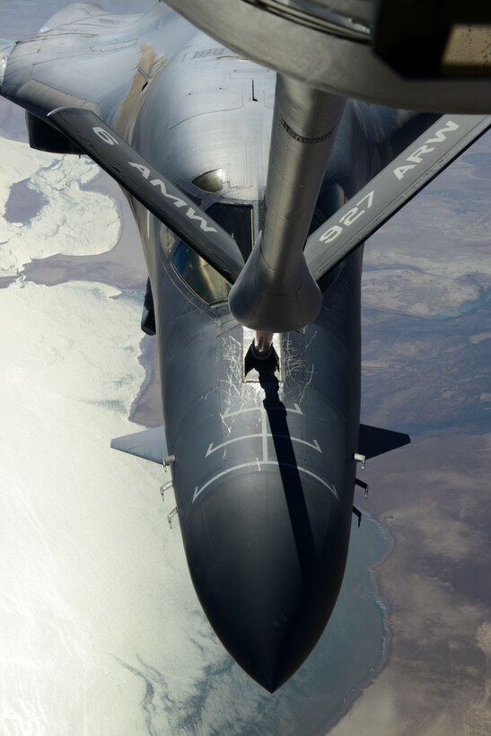A KC-135 Stratotanker refuels a B-1B Lancer prior to air strikes over Syria Sept. 27, 2014. The B-1B Lancer was part of a large coalition strike package to strike targets in Syria.(U.S. Air Force photo by Staff Sgt. Ciara Wymbs)