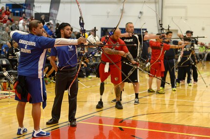 U.S. Department of Defense athletes compete in archery during the 2014 Warrior Games at the U.S. Olympic Training Center, Colorado Springs, Colo., Sept. 30, 2014. The Warrior Games consists of athletes from throughout the Department Of Defense, who compete in Paralympic style events for their respective military branch. The goal of the games is to help highlight the limitless potential of warriors through competitive sports. 