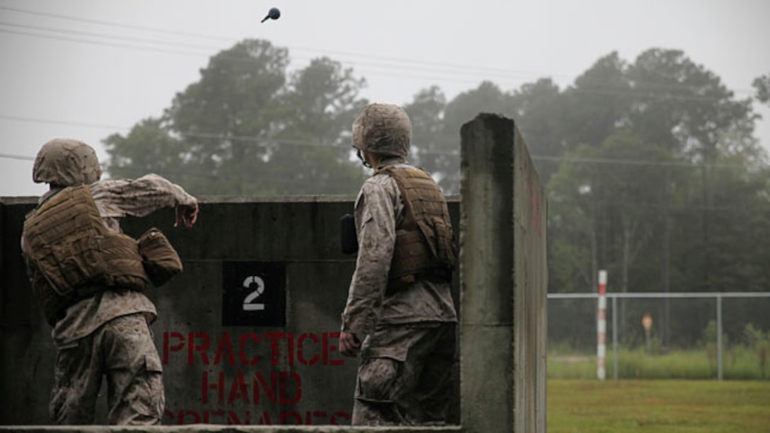 Corporal Orry Kraczek, a heavy equipment mechanic with 2nd Maintenance Battalion, 2nd Marine Logistics Group, and Rice Lake, Wis., native, tosses a practice hand grenade prior to live-fire training with the M67 Fragmentation Hand Grenade aboard Marine Corps Base Camp Lejeune, N.C., Sept. 25, 2014.  Practicing grenade throws helps Marines gain confidence in using the M67 in a combat situation. Marines and sailors with the battalion conducted a field exercise Sept. 18-Oct. 1, 2014, to reinforce their ability to accomplish battalion-level, mission essential tasks.