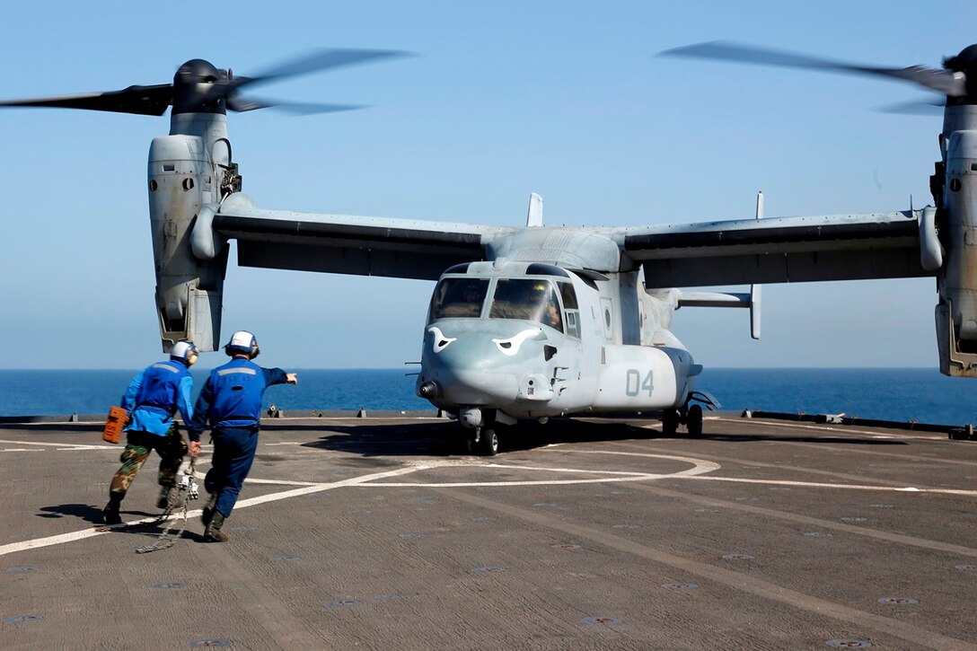 Sailors with the USS Comstock run to restrain an MV-22B Osprey with Marine Medium Tiltrotor Squadron 163 (Reinforced), 11th Marine Expeditionary Unit (MEU), Sept. 28. The 11th MEU is a forward-deployed, flexible sea-based Marine Air-Ground Task Force embarked with the Makin Island Amphibious Ready Group in the U.S. 5th Fleet area of responsibility. (U.S. Marine Corps photo by Sgt. Melissa Wenger/Released)