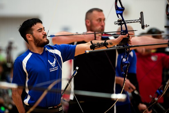 Air Force athlete Daniel Crain aims at his target in an archery qualification round during the 2014 Warrior Games Oct. 1, 2014, at the U.S. Olympic Training Center in Colorado Springs, Colo. The Warrior Games consist of athletes from the Defense Department, who compete in Paralympic-style events for their respective military branch. The goal of the games is to help highlight the potential of warriors through competitive sports. (U.S. Air Force photo/Airman 1st Class Scott Jackson)