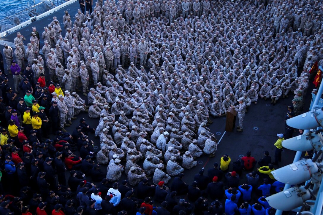 Brig. Gen. Carl  Mundy, commander, Combined Task Force 51, addresses Marines with the 11th Marine Expeditionary Unit (MEU) and sailors with the USS Makin Island, aboard the Makin Island, Sept. 29.  The Makin Island Amphibious Ready Group (ARG) and embarked 11th MEU provide a versatile sea-based, expeditionary force that can be tailored to a variety of missions in the U.S. 5th Fleet area of responsibility. (U.S. Marine Corps photo by Cpl. Laura Y. Raga/ RELEASED)