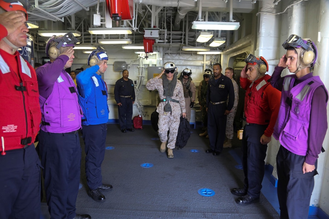 Brig. Gen. Carl Mundy, commander, Combined Task Force 51,  salutes as he departs the USS Makin Island following a visit, Sept. 29. The Makin Island Amphibious Ready Group (ARG) and embarked 11th Marine Expeditionary Unit (MEU) provide a versatile sea-based, expeditionary force that can be tailored to a variety of missions in the U.S. 5th Fleet area of responsibility.  (U.S. Marine Corps photo by Cpl. Laura Y. Raga/ RELEASED)