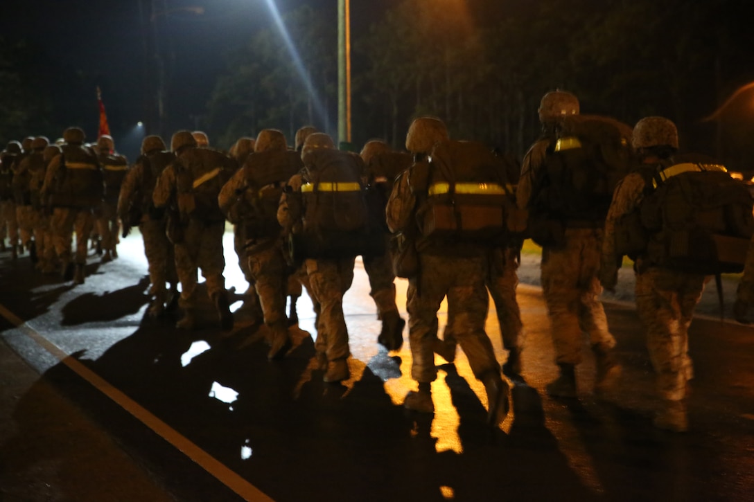 Marines with Battery A, Ground Combat Element Integrated Task Force, conduct a combat conditioning hike aboard Marine Corps Base Camp Lejeune, North Carolina, Oct. 3, 2014. The hike served as the Battery’s first major training event. From October 2014 to July 2015, the GCEITF will conduct individual and collective level skills training in designated ground combat arms occupational specialties in order to facilitate the standards based assessment of the physical performance of Marines in a simulated operating environment performing specific ground combat arms tasks. (U.S. Marine Corps photo by Cpl. Paul S. Martinez/Released)