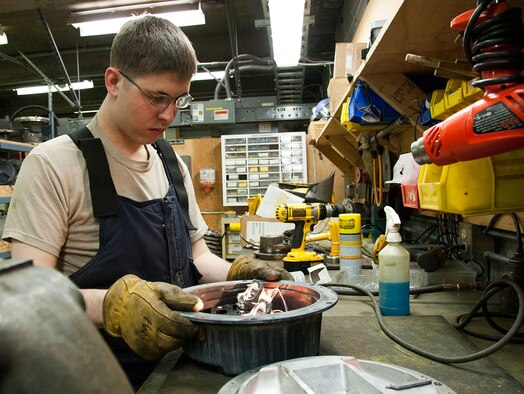 Airman 1st Class Brennen Hankins fixes a semi-thrush threshold light Sept. 22, 2014, at Joint Base Elmendorf-Richardson, Alaska. The electricians monitor and keep the electricity that powers these lights under control to ensure the right amount of voltage is sent to its destination. Hankins is an electrical systems journeyman with the 773rd Civil Engineer Squadron. (U.S Air Force photo/Airman 1st Class Tammie Ramsouer)