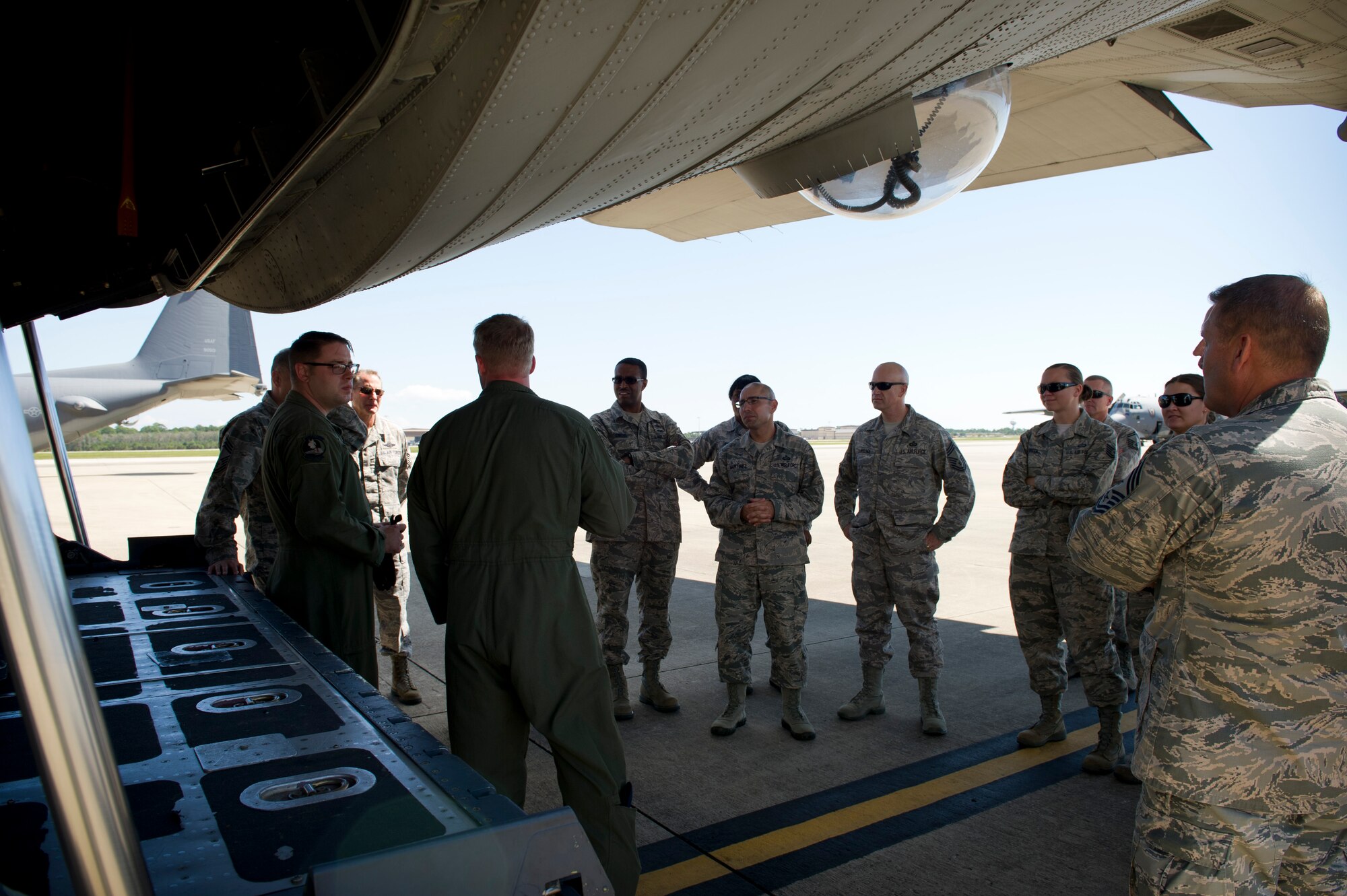 Special mission aviators from the 4th Special Operations Squadron explain functions of the AC-130U Gunship to Chief Master Sgts. during a Chiefs tour at Hurlburt Field, Fla., Oct. 1, 2014. Chiefs who don’t usually interact with aircraft had the opportunity to tour the flight line and learn about its daily operations. (U.S. Air Force photo/Senior Airman Krystal M. Garrett)