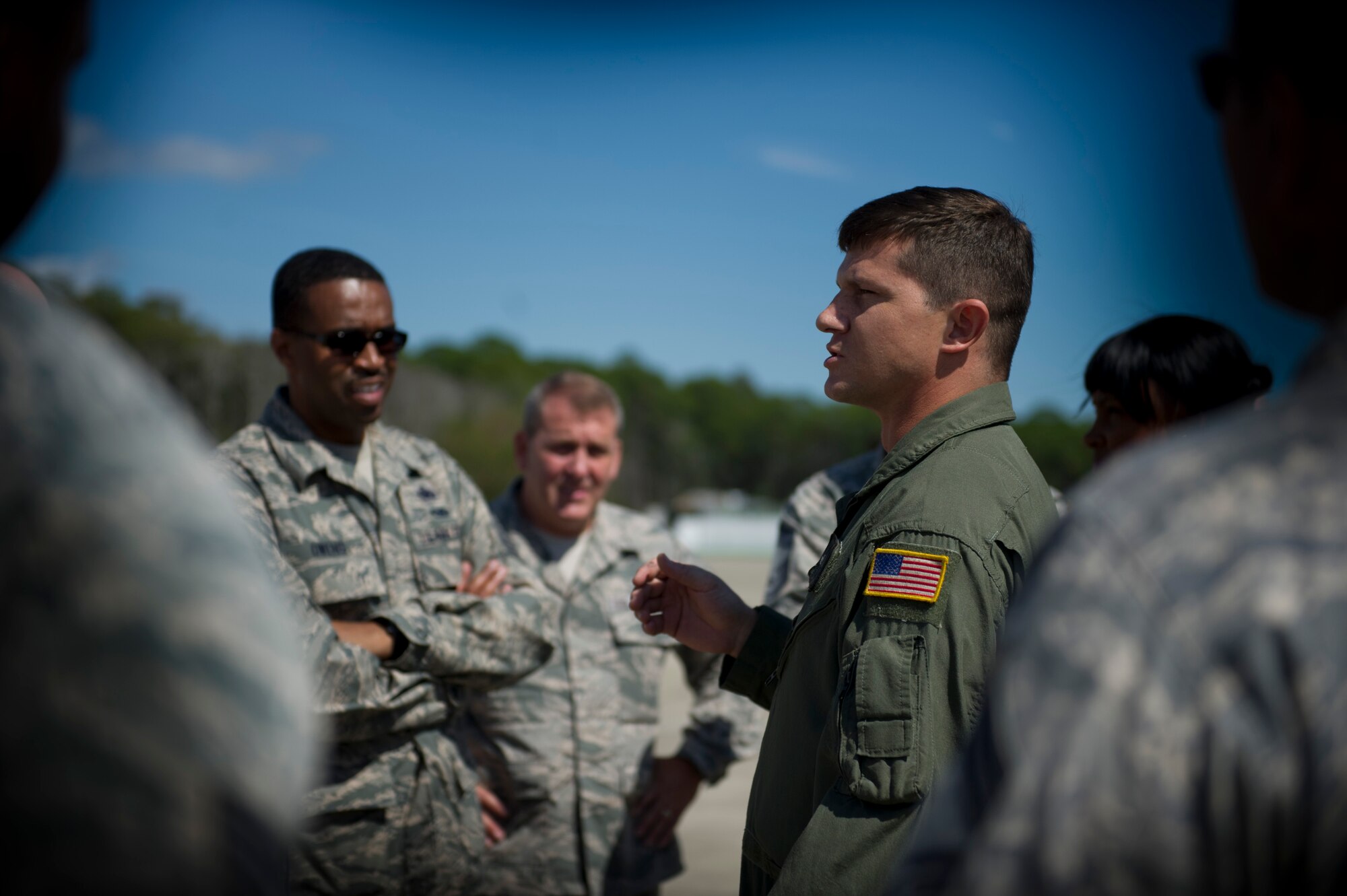 Staff Sgt. Mike Mckay, 8th Special Operations Squadron flight engineer, briefs Chief Master Sgts. on the operations of a CV-22 Osprey during a Chiefs tour at Hurlburt Field, Fla., Oct. 1, 2014. Chiefs who don’t usually interact with aircraft had the opportunity to tour the flight line and learn about its daily operations, enhancing their understanding of Hurlburt’s mission. (U.S. Air Force photo/Senior Airman Krystal M. Garrett) 