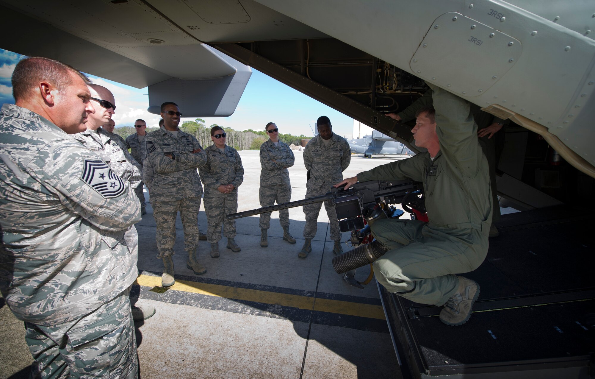 Staff Sgt. Mike Mckay, 8th Special Operations Squadron flight engineer, briefs Chief Master Sgts. on the operations of a CV-22 Osprey during a Chiefs tour at Hurlburt Field, Fla., Oct. 1, 2014. During the tour, chiefs networked during lunch and visited two of Hurlburt’s aircraft.  (U.S. Air Force photo/Senior Airman Krystal M. Garrett)