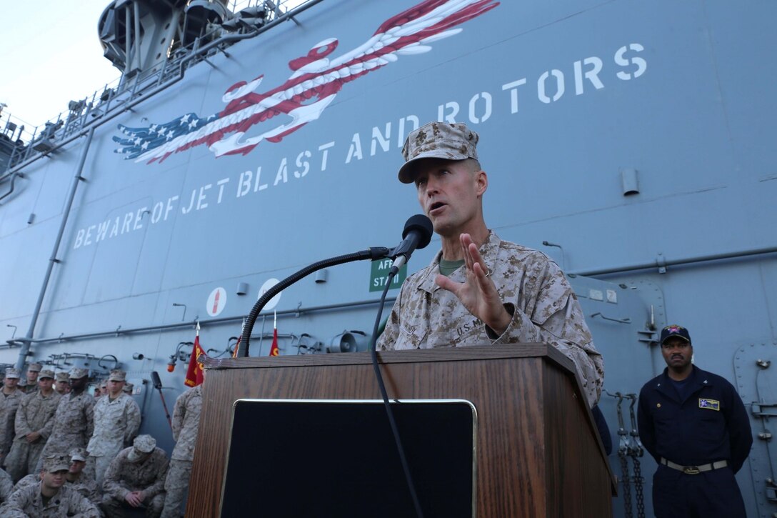 Brig. Gen. Carl E. Mundy, the Task Force commanding general, speaks to the 11th Marine Expeditionary Unit (MEU) aboard the USS Makin Island Sept. 29.  The 11th MEU is a forward-deployed, flexible sea-based Marine Air-Ground Task Force embarked with the Makin Island Amphibious ready Group in the 5th fleet area of responsibility. (U.S. Marine Corps photo by Cpl. Demetrius Morgan/NOT RELEASED)
