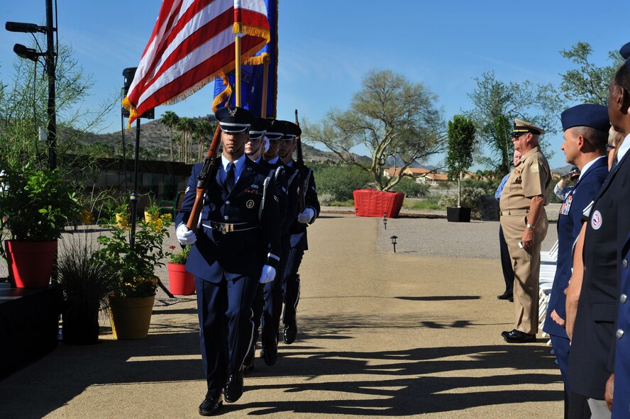 The Luke Air Force Base Honor Guard marches in to present the colors at the opening ceremony of The Moving Wall Vietnam Memorial in Goodyear, Ariz., Oct. 03, 2014.  Engraved in the memorial are the names of more than 58,000 Vietnam Veterans who made the ultimate sacrifice.  (U.S. Air Force Photo by Senior Airman Jenna Sarvinski)