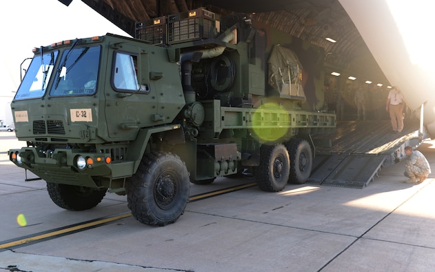 ALTUS AIR FORCE BASE, Okla. – U.S Army Soldiers from the 4th Battalion, 3rd Air Defense Artillery Regiment, 31st Air Defense Artillery Brigade, Fort Sill, Okla., unload a vehicle from a U.S. Air Force C-17 Globemaster III cargo aircraft during joint mission training, Oct. 2, 2014. The heaviest object loaded during the training was 66,000 pounds. (U.S. Air Force photo by Airman 1st Class Megan E. Acs/Released)
