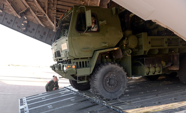 ALTUS AIR FORCE BASE, Okla. – A U.S. Army Soldier from the 4th Battalion, 3rd Air Defense Artillery Regiment, 31st Air Defense Artillery Brigade, Fort Sill, Okla., drives a vehicle off a U.S. Air Force C-17 Globemaster III cargo aircraft during joint mission training, Oct. 2, 2014. Roughly 100 Soldiers visited Altus AFB to practice rapid deployment with 15 pieces of equipment. (U.S. Air Force photo by Airman 1st Class Megan E. Acs/Released)