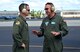 Col. Randy Huiss, 15th Wing commander, left, and Navy Capt. Lance Scott, Patrol and Reconnaissance Wing Two commander, talk before Huiss receives a tour of a P-3 Orion maritime patrol aircraft at Joint Base Pearl Harbor-Hickam, Hawaii, Oct. 2, 2014. Navy and Marine Corps aircraft have temporarily relocated to JBPHH due to airfield construction at Marine Corps Air Station Kaneohe Bay. (U.S. Air Force photo by Staff Sgt. Alexander Martinez)