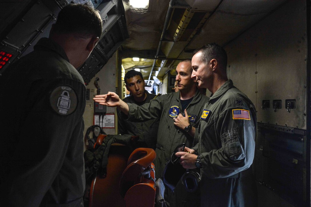 Col. Randy Huiss, 15th Wing commander, tours a P-3C Orion maritime patrol aircraft belonging to the ‘Golden Eagles’ of Patrol Squadron (VP) 9 at Joint Base Pearl Harbor Hickam Hawaii. Patrol Squadron units will be operating out of Hickam Airfield during a two-month renovation of Marine Corps Base Hawaii spaces, requiring coordination and cooperation between Navy and Air Force commands to ensure successful missions. (U.S. Navy photo by Mass Communication Specialist 3rd Class Amber L. Porter/Released)