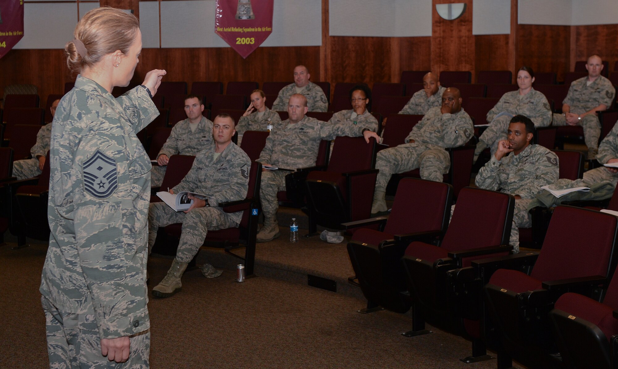 Senior Master Sgt. Keena Bassi, 22nd Aircraft Maintenance Squadron first sergeant, gives a briefing Oct. 1, 2014, at McConnell Air Force Base, Kan. Bassi discusses the duties and responsibilities of being a first sergeant to a group of non-commissioned officers and senior NCOs during a symposium. After attending the symposium all members are authorized to fill-in as unit first sergeants. (U.S. Air Force photo/Airman 1st Class Colby L. Hardin)