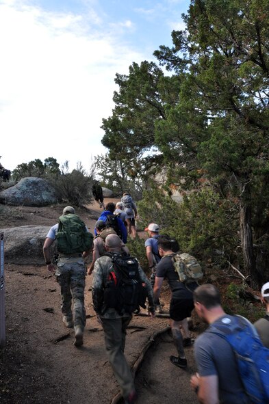 Pararescumen start a seven-mile hike up 10,500 feet above sea level during the 2014 Guardian Angel Rodeo, Albuquerque, New Mexico, September 26, 2014. The rodeo, or competition, was a week-long event that tested the PJs on land navigation skills, high-angel rope rescues, survival techniques, medical skills, weapons operations and overall physical endurance. (U.S. Air Force photo/ Tech. Sgt. Katie Spencer)