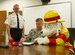 Chief Timothy Pitman, 11th Wing Civil Engineer Squadron Fire Department chief, and Col. Daniel Waters, 11th Wing vice commander, sign the Fire Prevention Week proclamation with Sparky, the fire house dog, on Joint Base Andrews, Md., Oct. 3, 2014. This year, in hopes to better educate the public about the true value of working smoke detectors, the slogan for Fire Prevention Week is ‘Working smoke alarms save lives, test yours every month!’ (U.S. Air Force photo by Senior Airman Mariah Haddenham/Released)