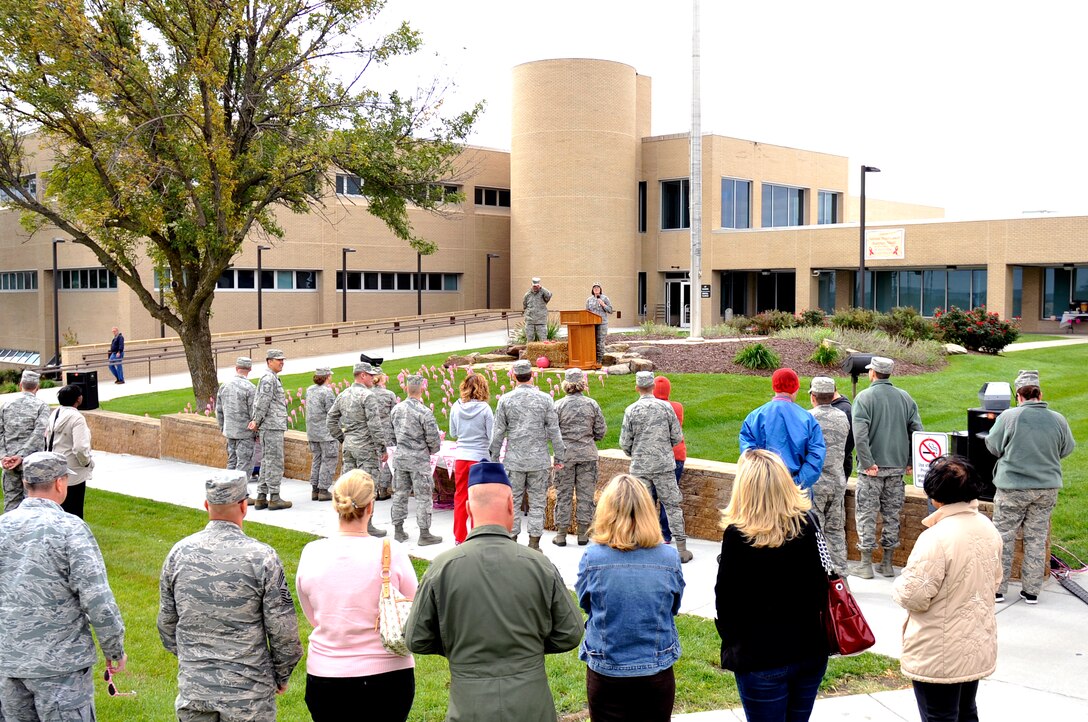 U.S. Air Force Lt. Col. Julie Guill, 55th Medical Support Squadron commander, speaks to members of Team Offutt during the Blow Away Breast Cancer event Oct. 3 on the front lawn of the Ehrling Bergquist clinic. In the last five years, this clinic has found 83 breast cancers leading to highly successful outcomes. (U.S. Air Force photo by Jeff W. Gates)