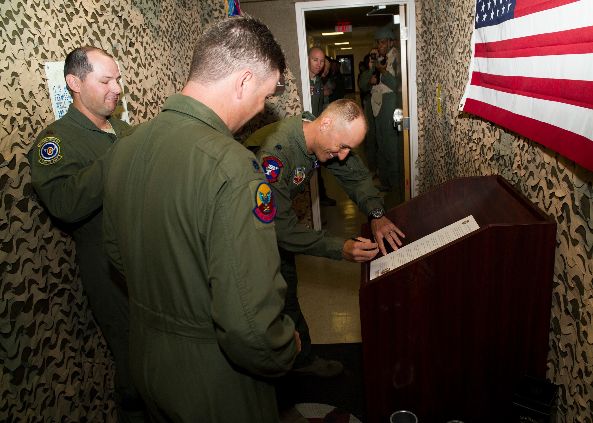 Lieutenant Col. Steven Beattie, 29th Attack Squadron commander and Lt. Col. Juan Torres, 9thATKS commander sign an armistice agreement at Holloman Air Force Base, N.M., Sept. 30. In an attempt to ensure consistency among their students, the 9th and 29th Attack Squadron’s collaborated through a series of friendly challenges, ultimately culminating in an armistice to signify the unity of their mission. (U.S. Air Force photo by Senior Airman Daniel E. F. Liddicoet/Released)