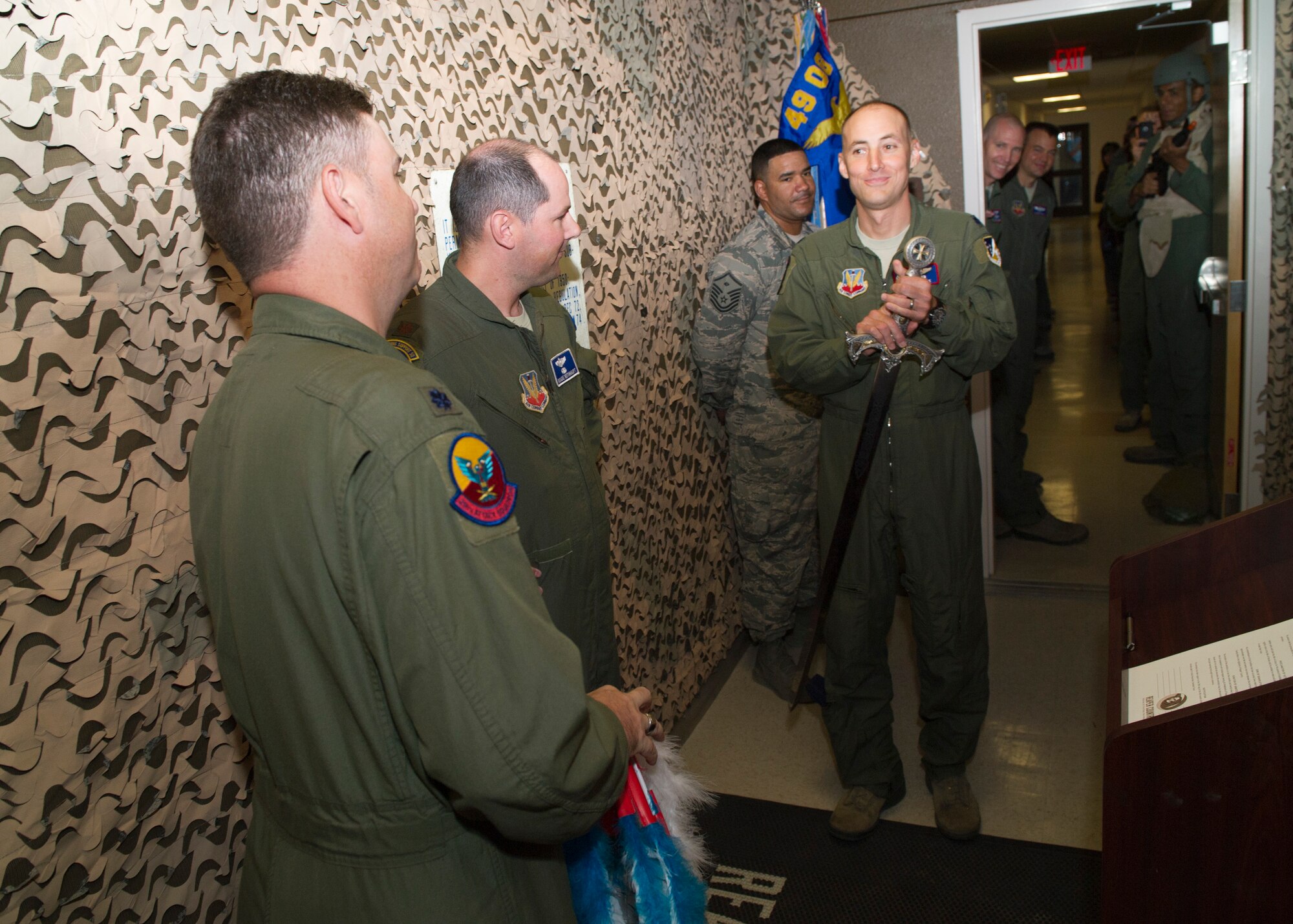 Lieutenant Col. Steven Beattie, 29th Attack Squadron commander and Lt. Col. Juan Torres, 9th ATKS commander exchange hostage items from each other’s squadrons during their armistice at Holloman Air Force Base, N.M., Sept. 30 In an attempt to ensure consistency among their students, the 9th and 29th Attack Squadron’s collaborated through a series of friendly challenges, ultimately culminating in an armistice to signify the unity of their mission. (U.S. Air Force photo by Senior Airman Daniel E. F. Liddicoet/Released)