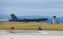 A B-52 Stratofortress takes off from the runway at Ellsworth Air Force Base, S.D., Oct. 1, 2014 to return home to Minot AFB, N.D. For six months, 300 Airmen and approximately eight B-52s continued flight operations out of Ellsworth while their runway underwent the final phase of a two year long reconstruction project. (U.S. Air Force photo by Senior Airman Zachary Hada/Released)