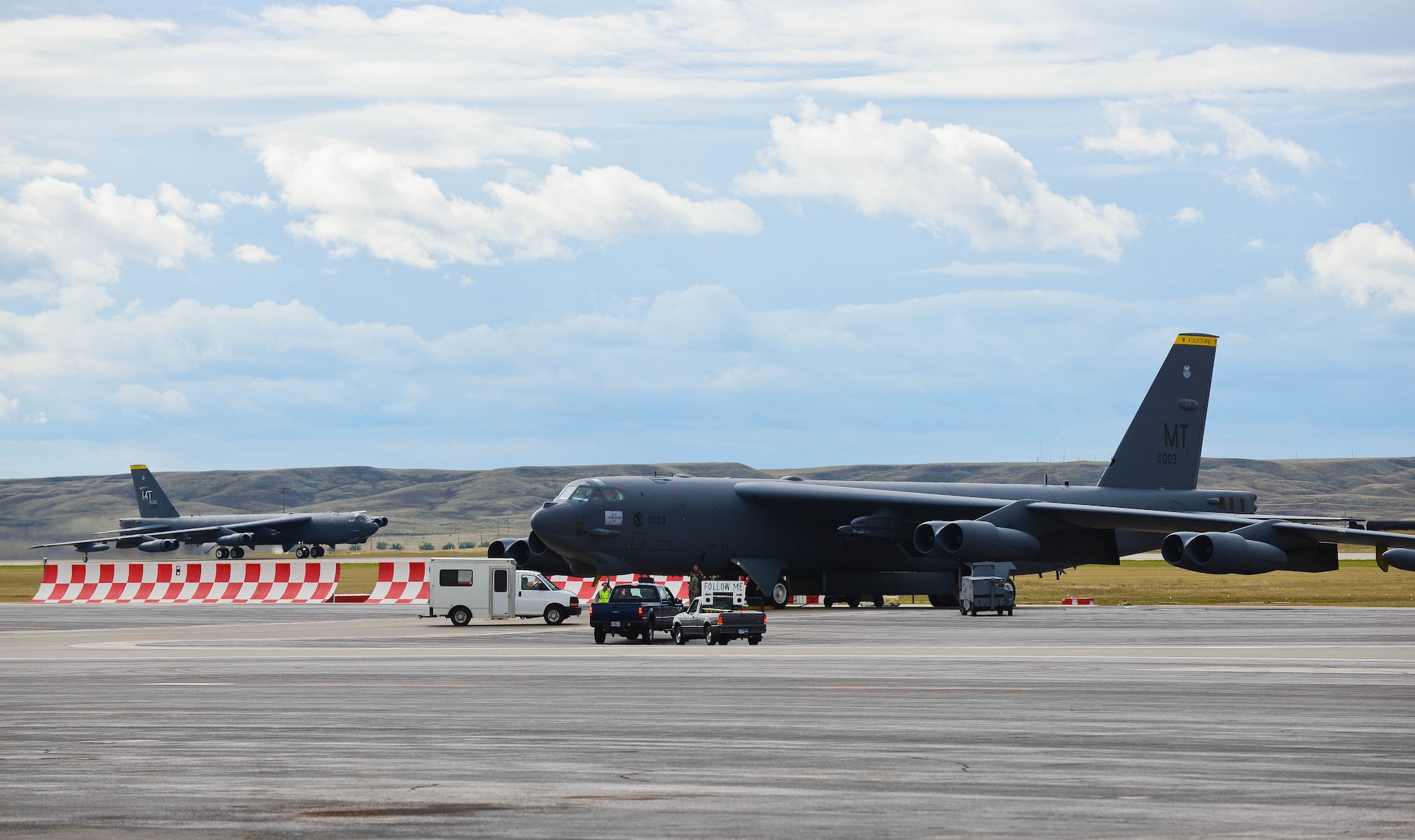 A B-52 Stratofortress takes off from the runway at Ellsworth Air Force Base, S.D., Oct. 1, 2014 to return home to Minot AFB, N.D. Approximately eight B-52’s and 300 Airmen from Minot have been temporarily assigned to Ellsworth to continue operations while their runway underwent the final phase of a reconstruction project. (U.S. Air Force photo by Senior Airman Zachary Hada/Released)