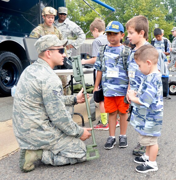 Senior Airman Buck Taylor, 2nd Civil Engineer Squadron Explosive Ordnance Disposal journeyman, demonstrates the use of mine detecting equipment on Barksdale Air Force Base, La., Sept. 27, 2014. As part of Operation Hero, EOD members demonstrate all the tools used to keep Airmen safe during deployments. (U.S. Air Force photo/Airman 1st Class Mozer. O. Da Cunha)