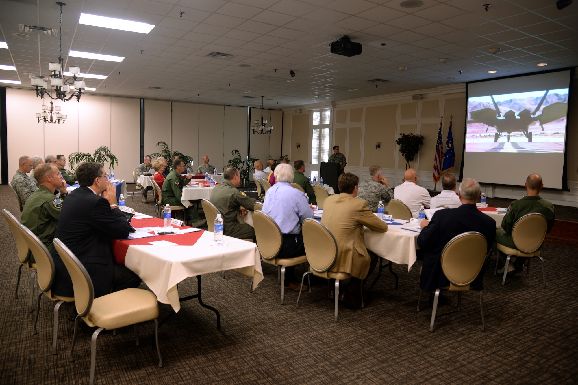 Attendees of the Ninth Air Force Civic Leader Forum watch a video detailing the combat airpower of Ninth Air Force. The three-day forum at Shaw Air Force Base, S.C., from Sept. 29 through Oct 1 brought civic leaders together with leadership from Ninth AF headquarters and wings. (U.S. Air Force photo by Airman 1st Class Jonathan Bass/Released)
