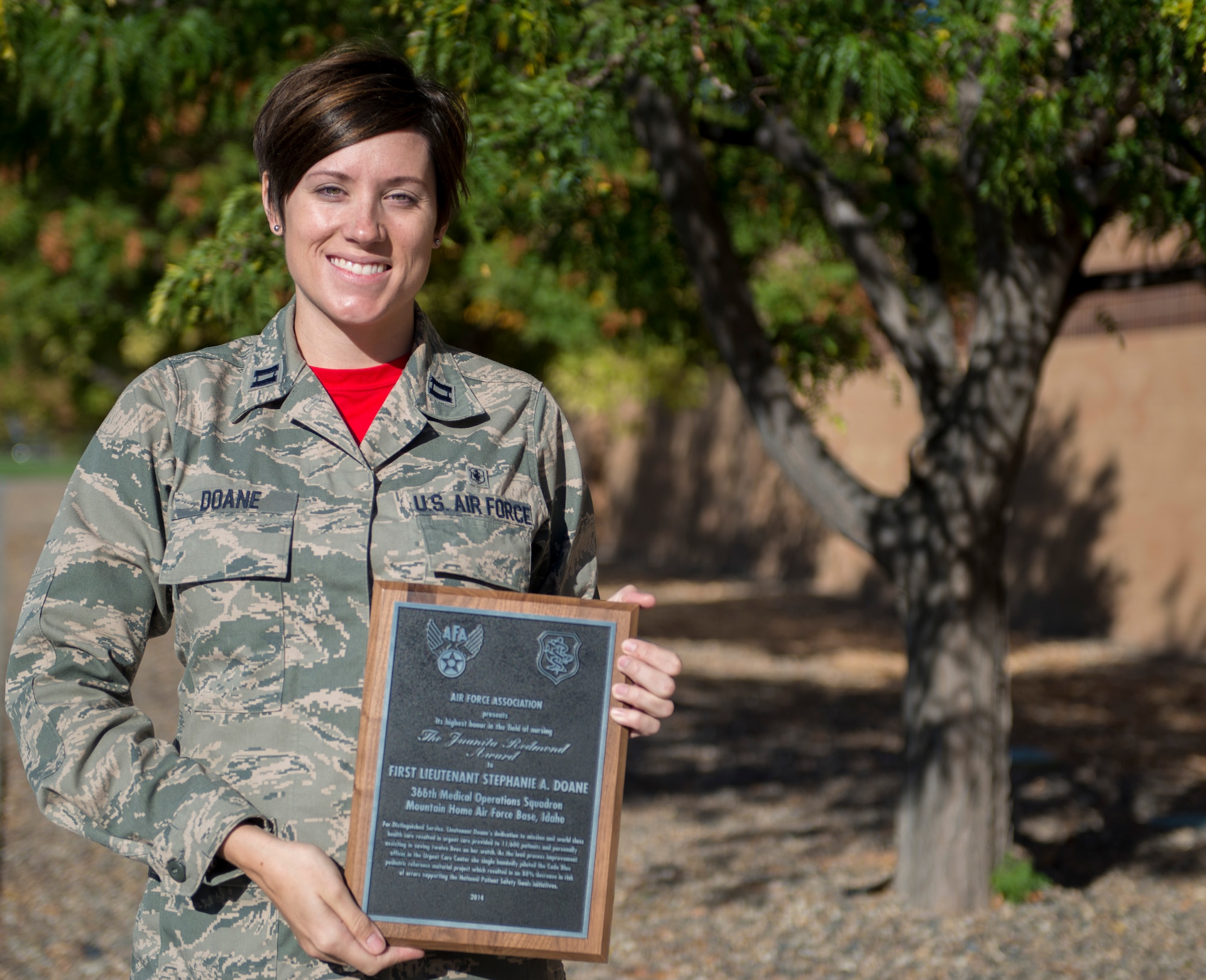 Capt. Stephanie Doane, 366th Medical Operations Squadron urgent care center clinical nurse, holds the 2014 Juanita Redmond award Oct. 3, 2014, at Mountain Home Air Force Base, Idaho. The award is the Air Force Association’s highest honor in the field of nursing. (U.S. Air Force photo by Airman 1st Class Brittany A. Chase/RELEASED)