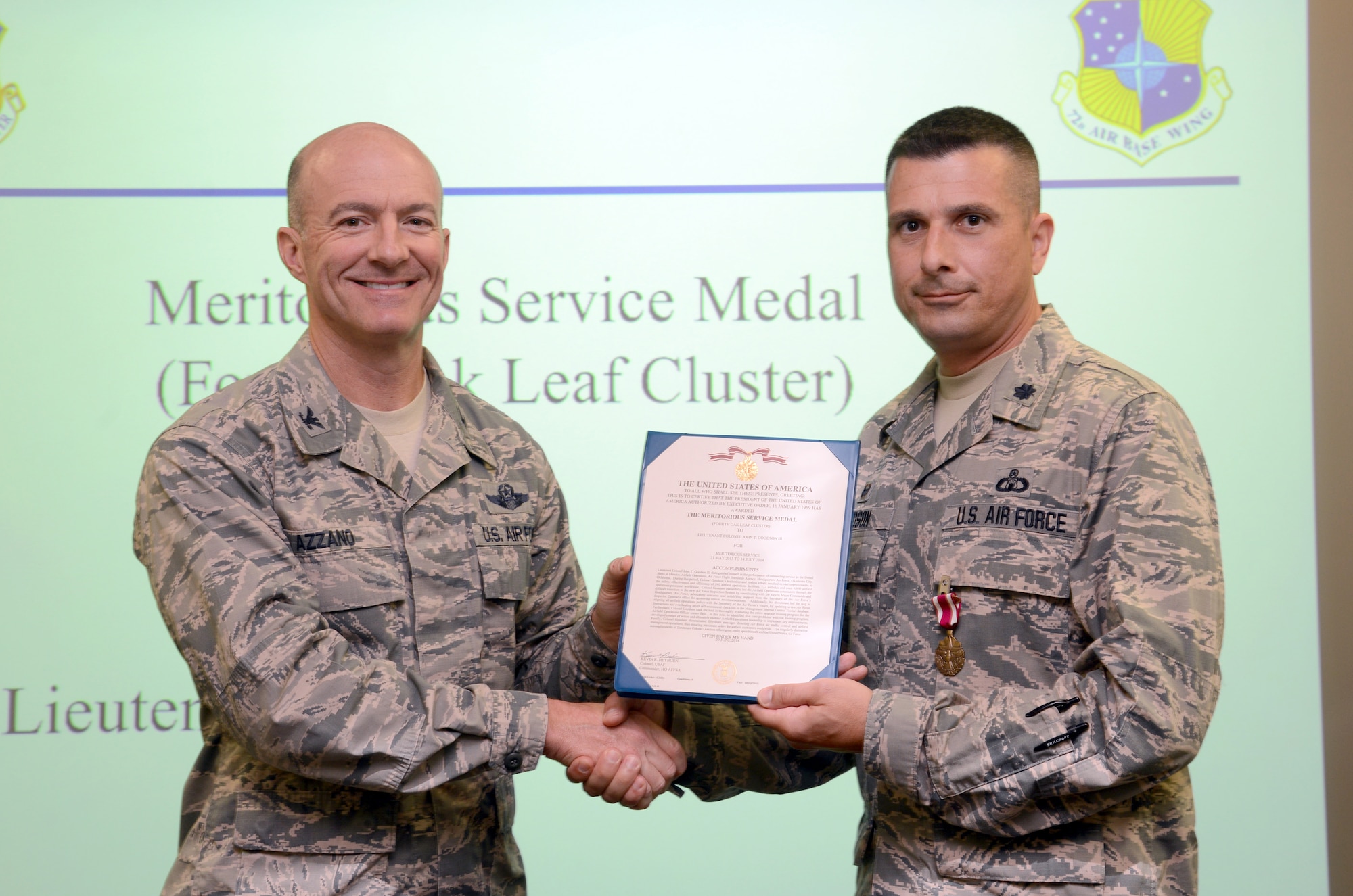 Lt. Col. John Goodson, 72nd Operations Support Squadron commander, right, was awarded the Meritorious Service Medal (Fourth Oak Leaf Cluster) for his outstanding service as director of Airfield Operations at the Air Force Flight Standards Agency, Headquarters Air Force, Oklahoma City. Col. Christopher Azzano, 72nd Air Base Wing and Tinker installation commander, presented Colonel Goodson with the award Sept. 23 during the 72nd ABW staff meeting. (Air Force photo by Kelly White)