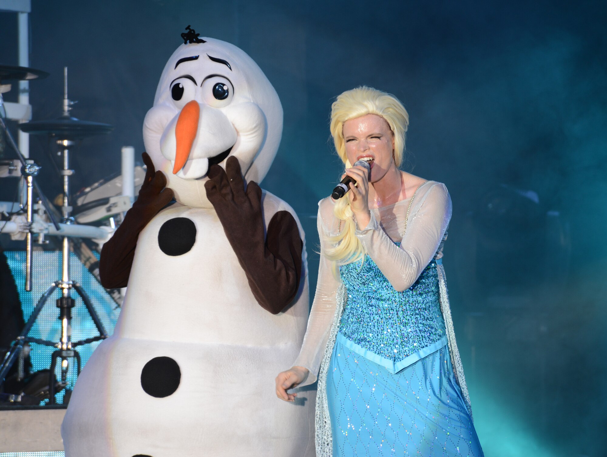 Tops in Blue members dressed as Elsa and Olaf from the movie “Frozen” perform at the Northside Fitness Center Oct. 1, 2014, on RAF Mildenhall, England. Through extensive choreography, costumes and lighting effects, Tops in Blue strives to entertain everyone in attendance, no matter the age or musical preference. (U.S. Air Force photo/Airman 1st Class Dillon Johnston/Released)