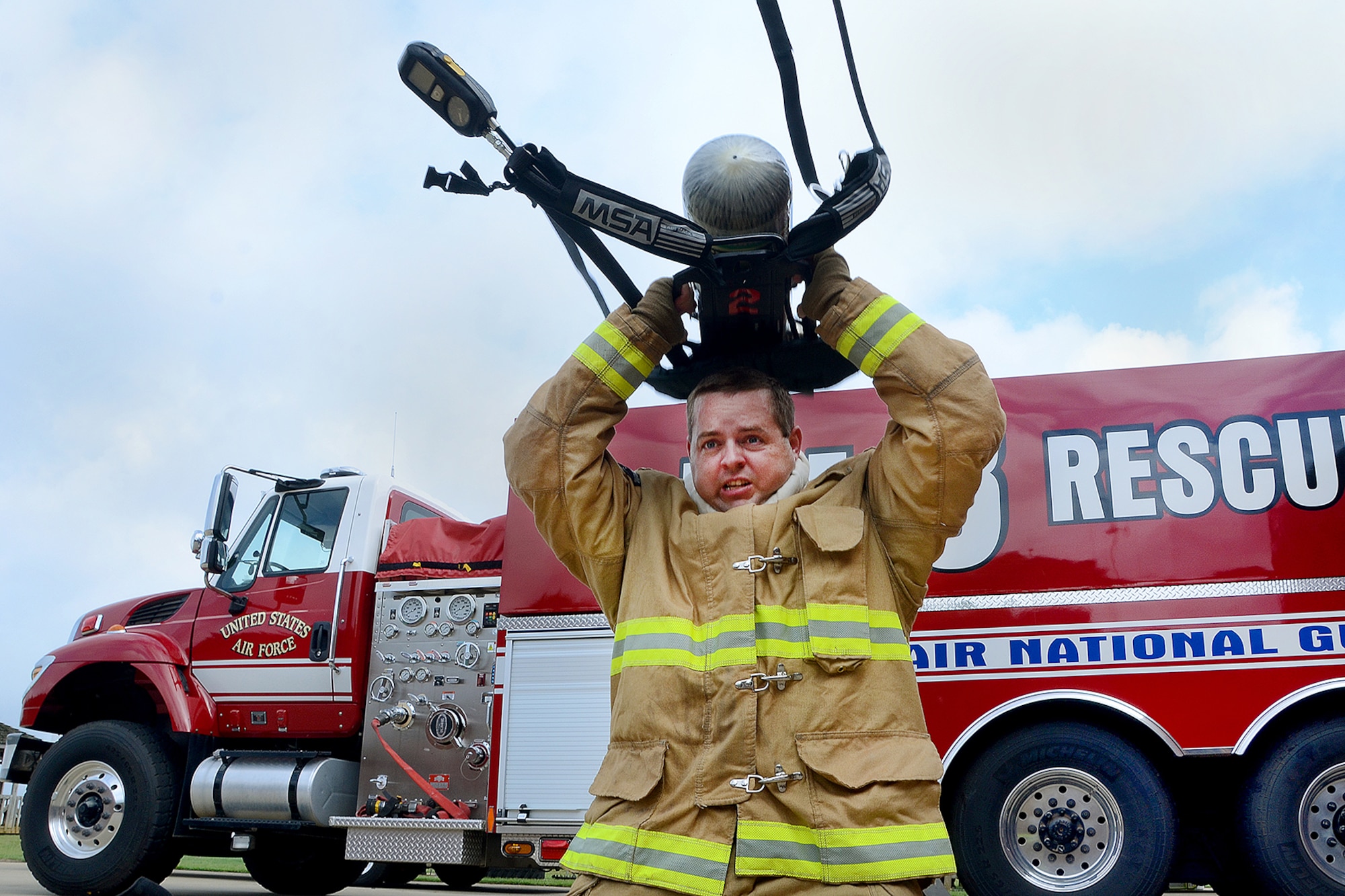 Richard Kirby, a fire fighter with the 169th Civil Engineer Squadron's Fire Department, performs a training drill on McEntire Joint National Guard Base, S.C., September 16, 2014.  Speed and accuracy of McEntire’s first response team is critical to maintain safety at home and on base.  (U.S. Air National Guard photo by Airman 1st Class Ashleigh S. Pavelek/Released) 