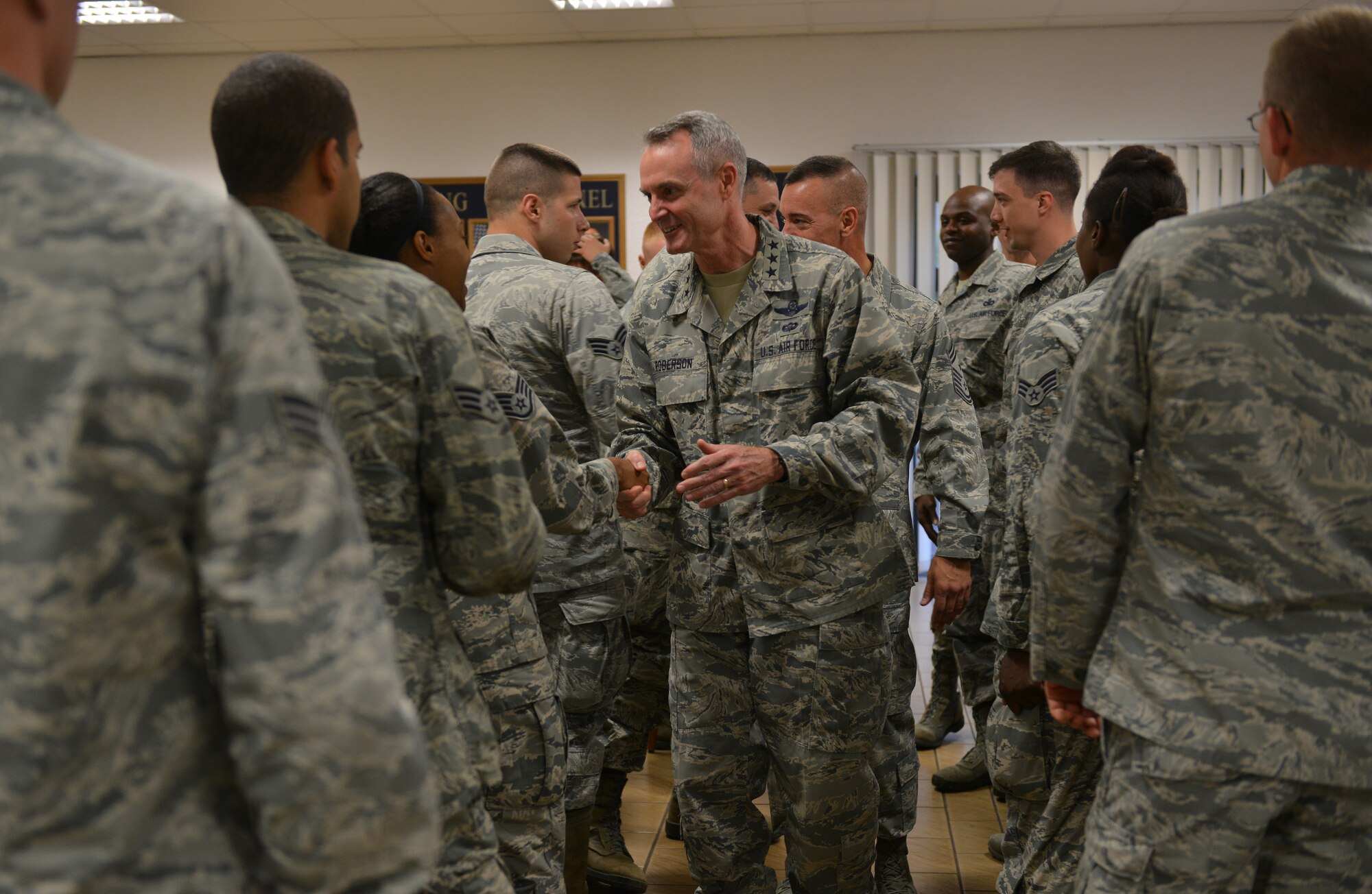 Lt. Gen. Darryl Roberson, 3rd Air Force and 17th Expeditionary Air Force commander, meets with Airmen from the 435th Air Ground Operations Wing during the 3rd Air Force immersion tour at the 435th Construction and Training Squadron compound on Ramstein Air Base, Germany, Sept. 30, 2014. During his tour of multiple units within the wing, Roberson learned about their day-to-day tasks and how they contribute to the overall Air Force mission. (U.S. Air Force photo/Senior Airman Holly Mansfield)