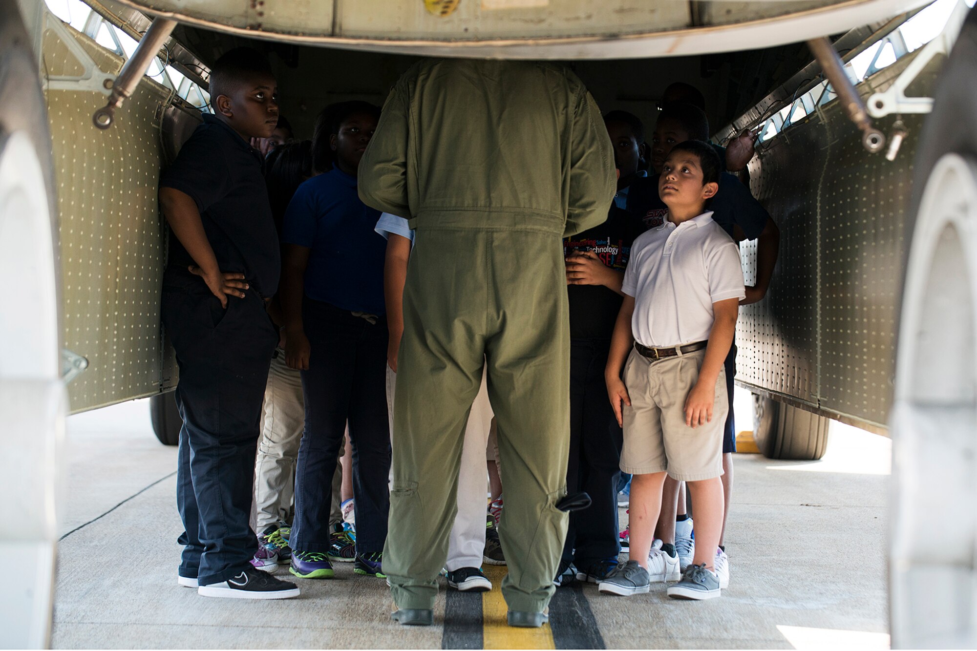 A group of STARBASE students stand in the bomb bay of a 93rd Bomb Squadron B-52H Stratofortress during a tour on Sept. 30, 2014, Barksdale Air Force Base, La. STARBASE students interact with military personnel who serve as positive role models to encourage their exploration of Science, Technology, Engineering and Mathematics curriculum. (U.S. Air Force photo by Master Sgt. Greg Steele/Released)